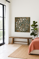 Lifestyle image of a Nadya carved wooden wall panel made from mango wood with intricate floral carving—an elegant wooden wall decoration with natural texture and artisan detail.