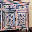 Close up image of a hand painted wooden furniture sideboard with floral motifs, unique furniture piece made from reclaimed wood, 180 × 40 × 90 cm.