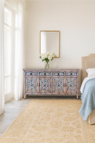 Lifestyle imagination of a hand painted wooden furniture sideboard with floral motifs, unique furniture piece made from reclaimed wood, 180 × 40 × 90 cm.