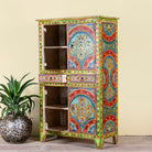 Side angle image showing open door of a Hand-painted cabinet made from reclaimed wood with colourful floral motifs – a sustainable furniture piece ideal for expressive Indian home decor.