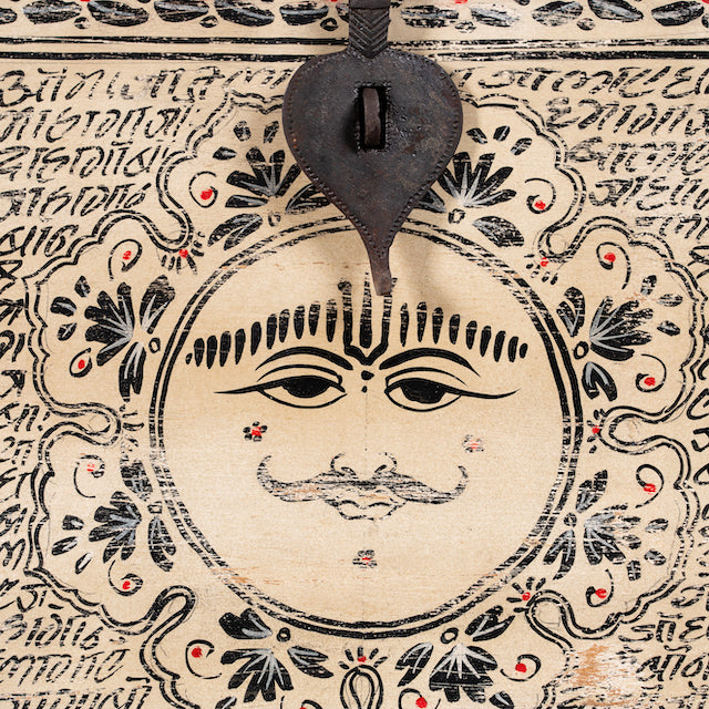 Close up image of a hand-painted reclaimed wood chest box with Indian motifs – vintage home decor and versatile storage with coffee table function.