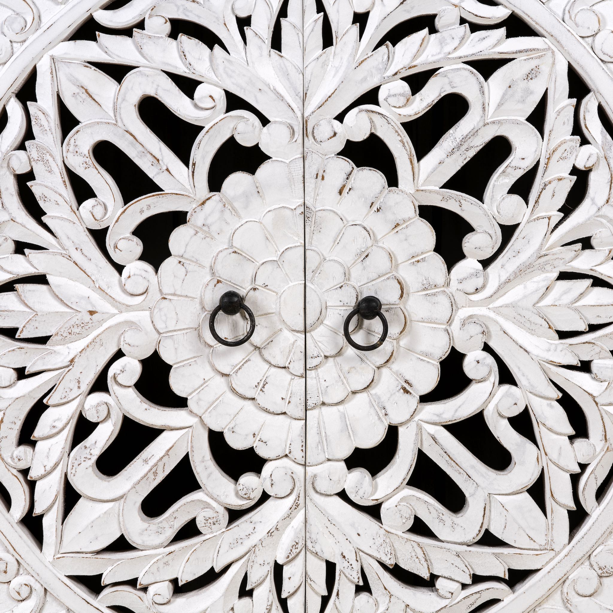 Close up image of a white carved wood cabinet made from solid mango wood with hand-carved Indian motifs, 90 × 90 × 40 cm.