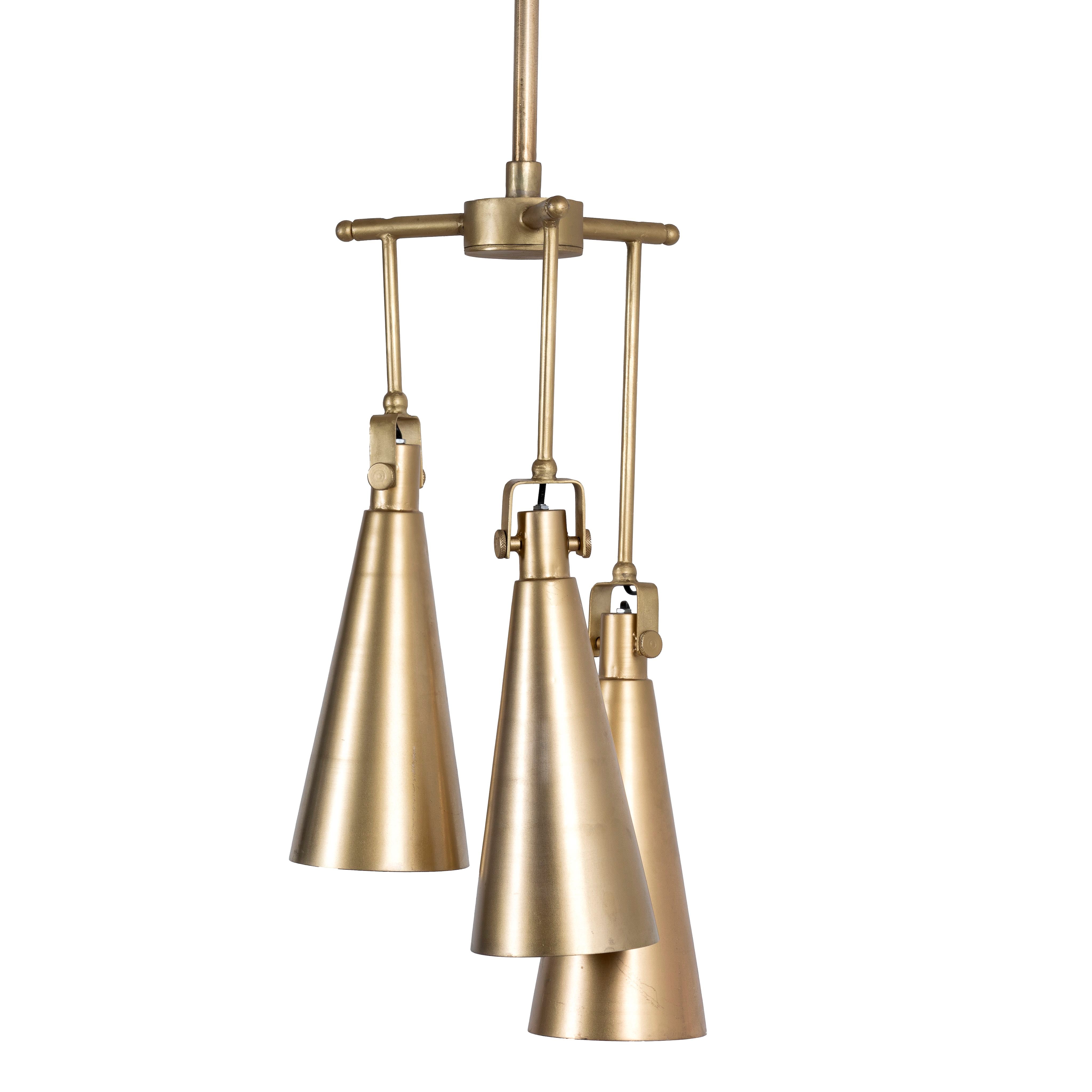 White background image of a polished brass iron pendant lamp with sleek tapered shape – minimalistic style lighting fixture with three lights for kitchens, dining rooms, or entryways.