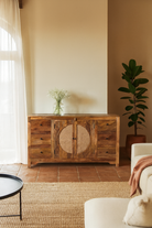 Lifestyle imagination of a hand-carved wood furniture sideboard with floral motifs and rattan cabinet doors, solid mango wood rattan furniture, 160 × 40 × 90 cm.