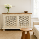 Lifestyle inspiration of a handcrafted mango wood carved console table with Indian motifs; vintage-style entryway table with storage shelf, 150 × 90 × 40 cm.