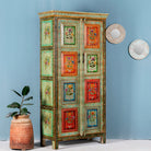 Side angle image of a hand-painted sustainable teak wood cabinet with floral motifs – Sangrur by Om Home & Garden, a one-of-a-kind piece of sustainable furniture with artistic expression.