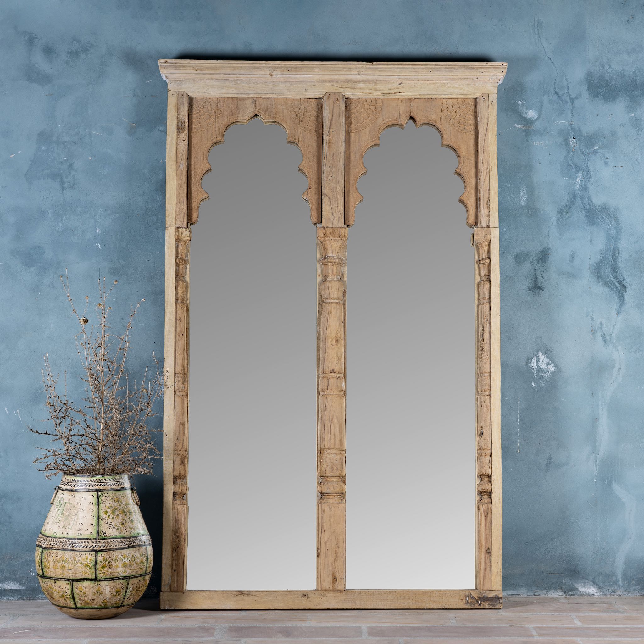 Tall two-arch mirror made from reclaimed natural teak wood, featuring scalloped arches and hand-carved column details in a minimalist rustic finish.