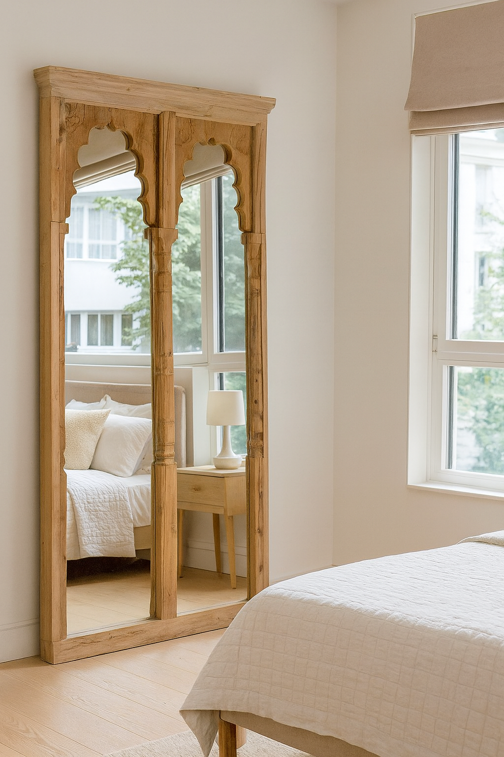 Wooden full-length mirror in a bedroom setting with a bed and window.