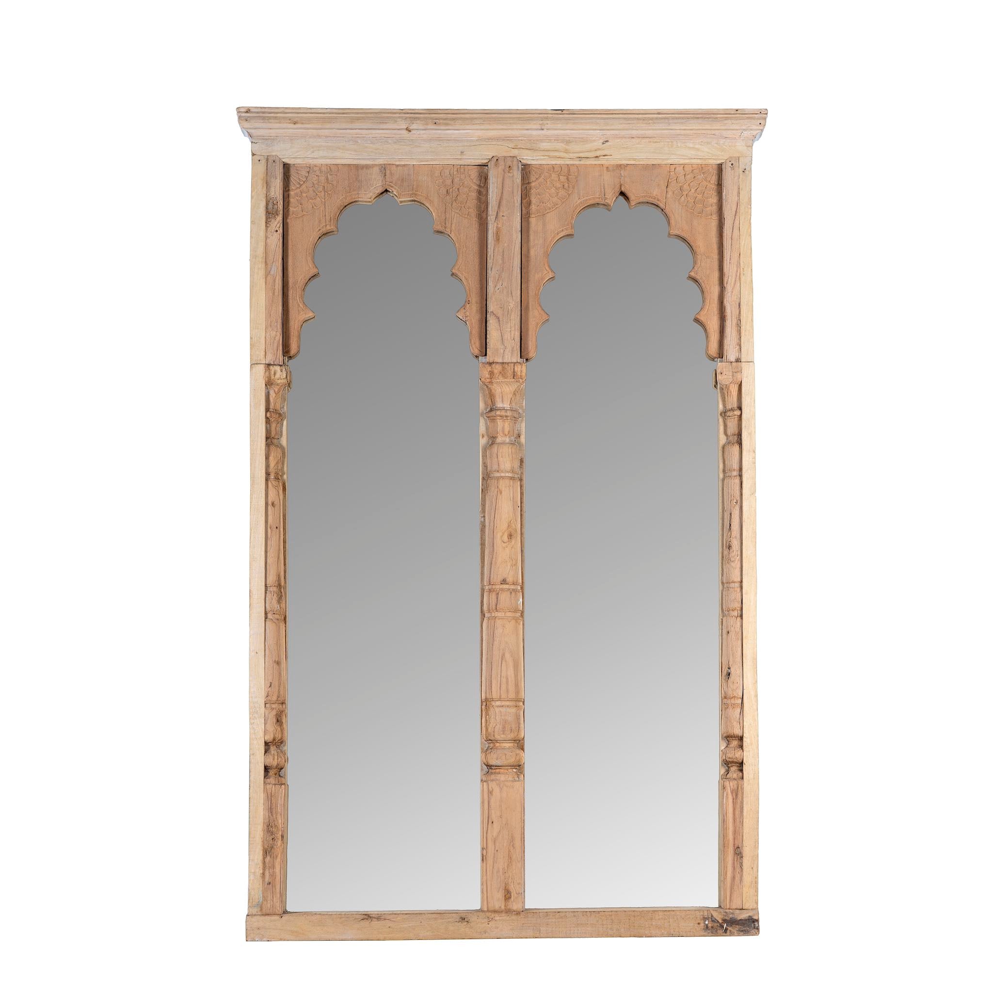 White background picture of a tall two-arch mirror made from reclaimed natural teak wood, featuring scalloped arches and hand-carved column details in a minimalist rustic finish.