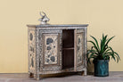 Side angle image with open door of a hand-painted cupboard made from reclaimed wood with Indian floral motifs; ideal for boho chic living room or unique furniture decor, 100 × 92 × 36 cm.
