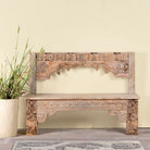 Shraddha bench made from bleached reclaimed teak wood with intricate hand-carved floral details, showcasing traditional Indian craftsmanship and sustainable furniture design.