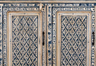 Close up image of a hand-painted sideboard made from reclaimed wood in indigo and cream tones – a handcrafted piece of reclaimed wood furniture perfect for hand painted interiors.