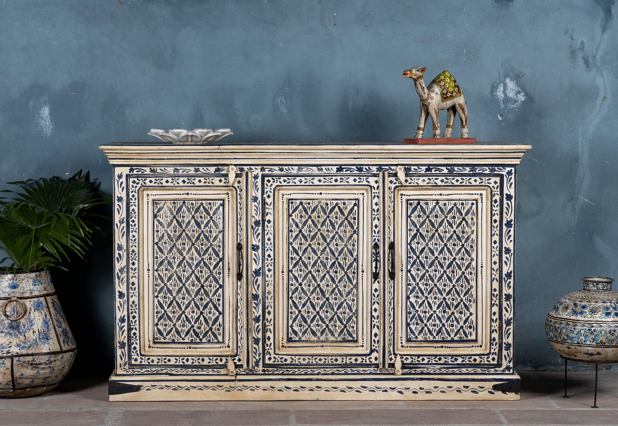 Hand-painted sideboard made from reclaimed wood in indigo and cream tones – a handcrafted piece of reclaimed wood furniture perfect for hand painted interiors.
