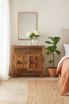 Lifestyle imagination of a driftwood cabinet made from reclaimed wood with panelled doors, drawers, and rustic finish, 90 × 40 × 90 cm.