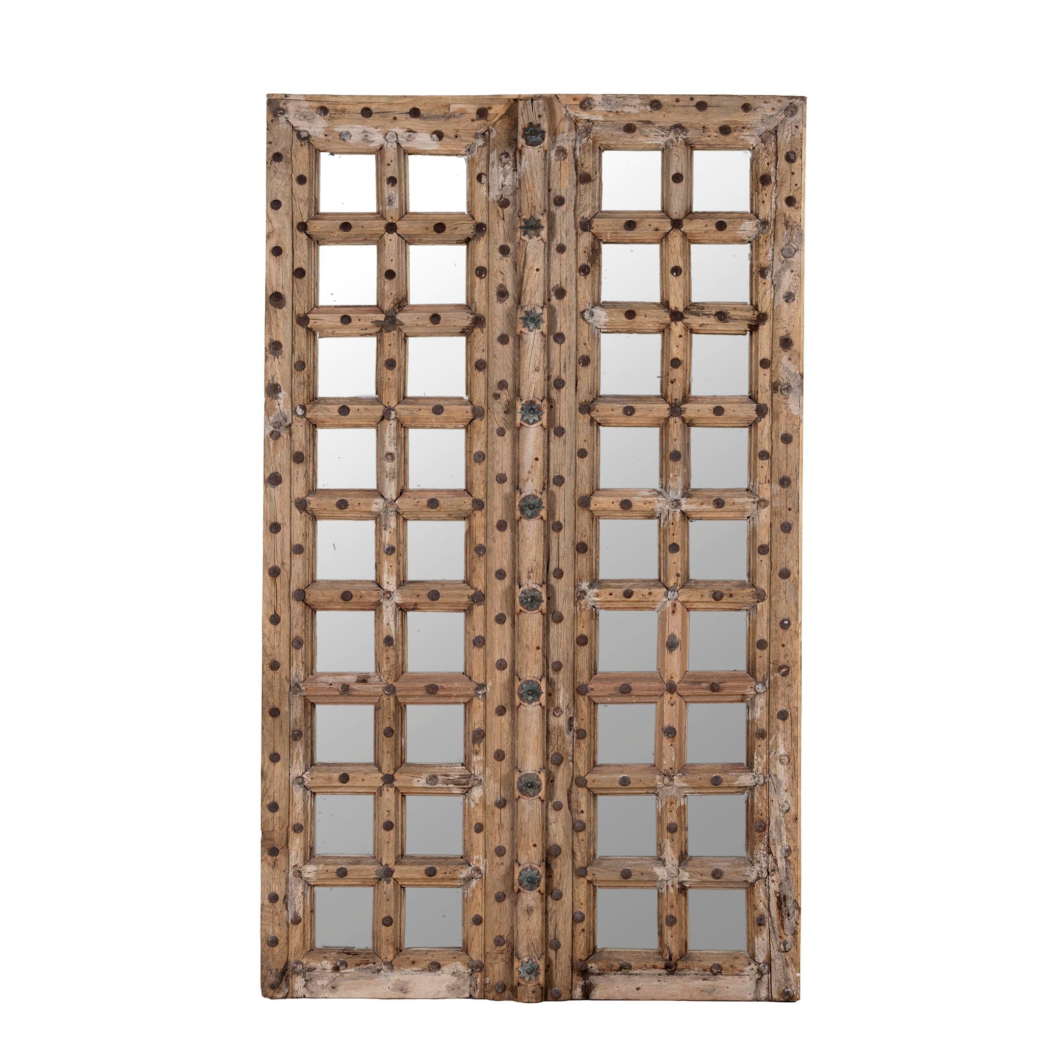 Wooden door with glass panels on a white background