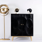 Black mango wood cabinet with carved circular patterns and brass-plated iron base, 91 × 43 × 111 cm.