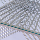 Close up image of a hexagonal wire metal base coffee table with glass top; modern coffee table industrial style, 92 × 80 × 46 cm.