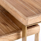 Close up image of a metal base side table with U-shaped brass-coated iron frame and mango wood tray top; wooden top side table, 38 × 38 × 75 cm.