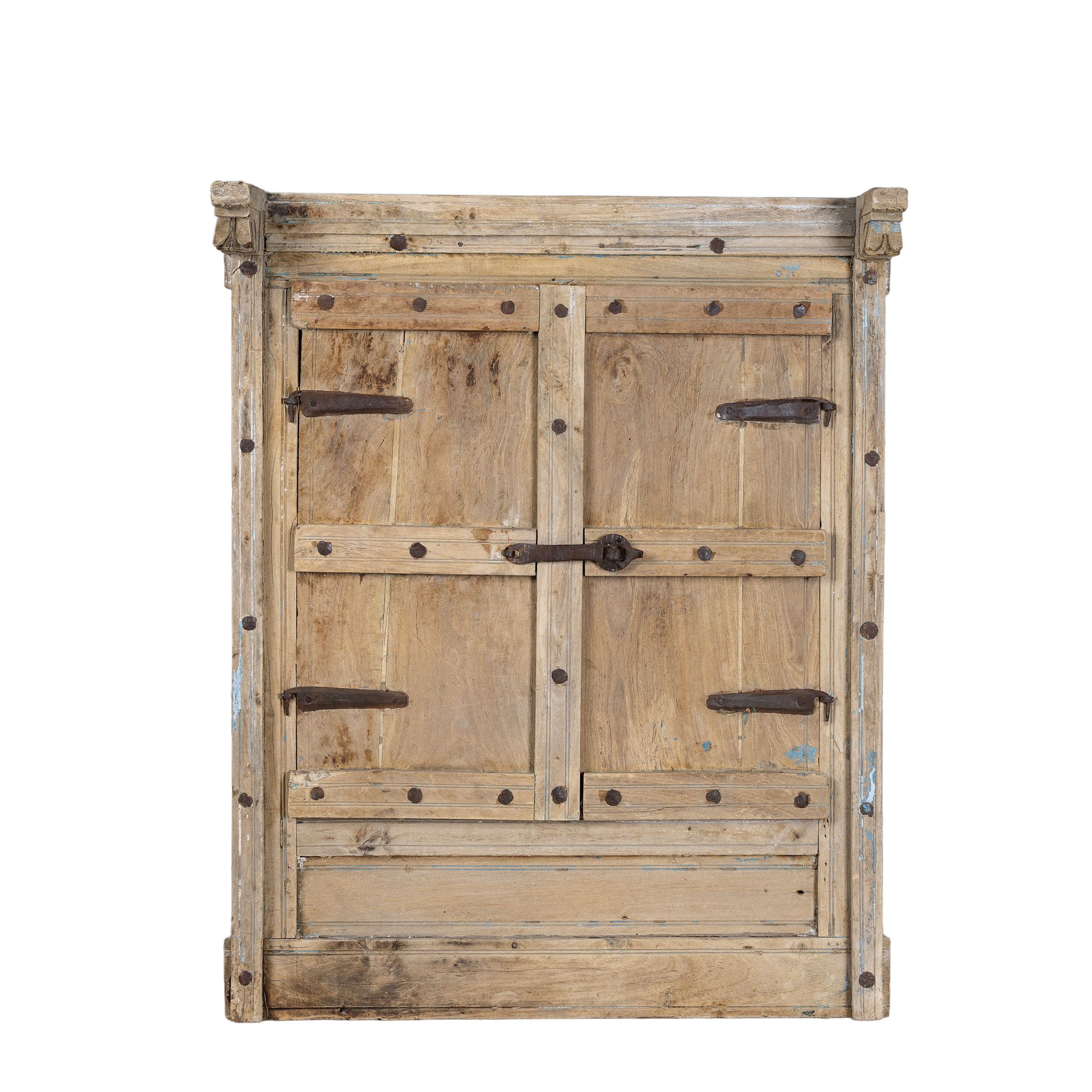 White background picture of an antique window mirror crafted from an old teak wood window with original shutters and detailed hand carvings. Natural sandblasted.