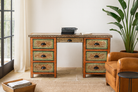 Lifestyle image of a hand-painted desk made of reclaimed wood with floral detailing – Tejasvini model by Om Home & Garden