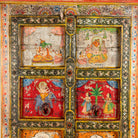 Close up image of a hand painted teak wood cabinet with floral motifs, restored Indian furniture online; unique storage piece, 100 × 44 × 185 cm.