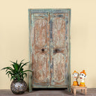 Hand-carved reclaimed wood wardrobe with vintage sunburst design – a sustainable furniture piece perfect for Indian home decor and rustic interiors.