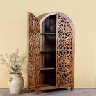 Side angle image with open door of a hand carved wooden wardrobe with arc-shaped cabinet design in solid mango wood – Aranya model by Om Home & Garden