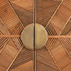 Close up image of a natural mango wood cupboard with carved linear design and antique brass legs, 91 × 40 × 109 cm.