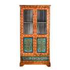 White background image of a hand-painted teak wood showcase with floral motifs and glass doors – sustainable furniture crafted from recycled wood with traditional Indian artistry.