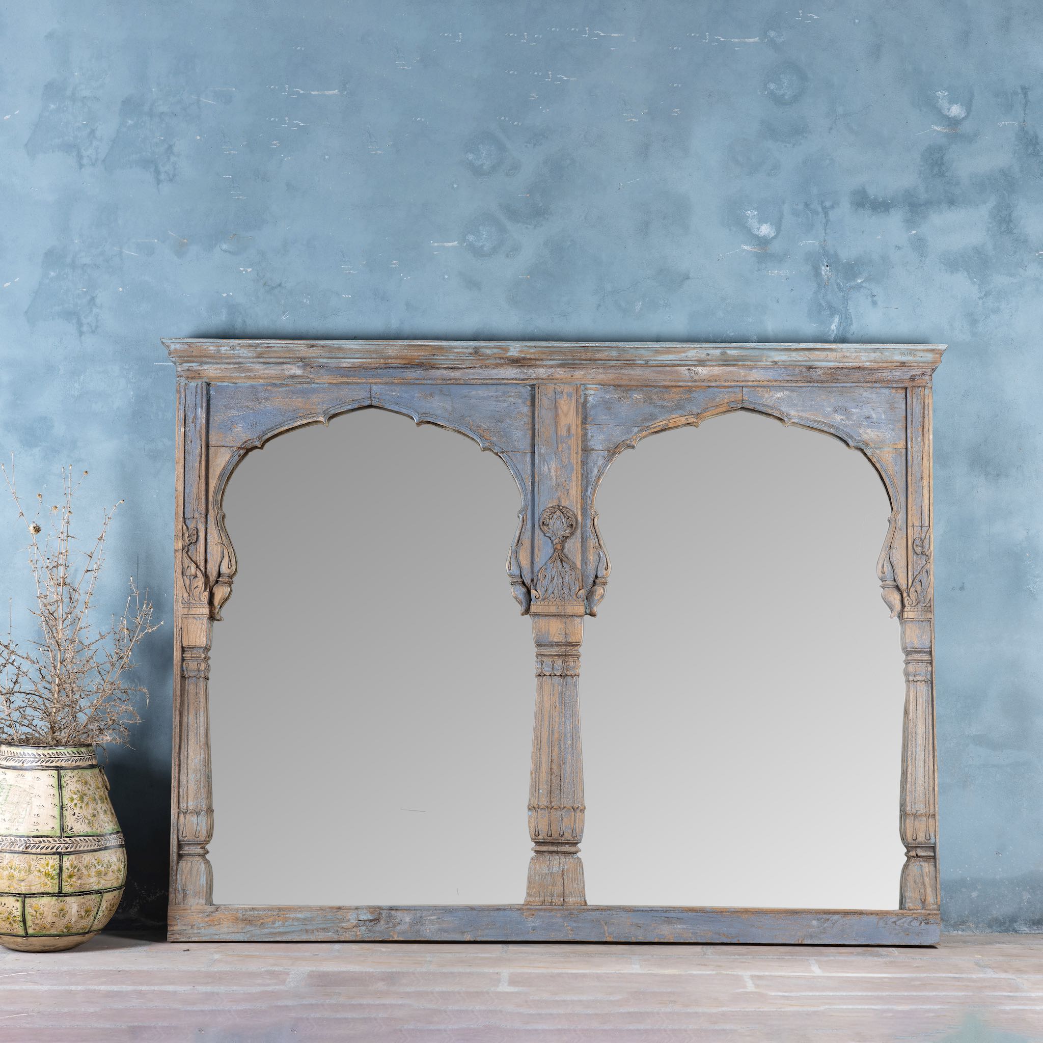 Vintage two-arch mirror crafted from reclaimed teak wood, with hand-carved details and a weathered blue patina finish.