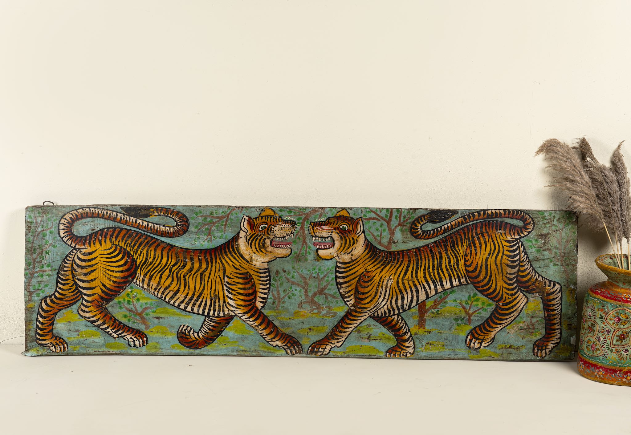 White background image of a Virat hand painted wall panel featuring a vibrant tiger motif on reclaimed antique teak wood—an artisan-crafted tiger wall decoration blending history and bold artistry.