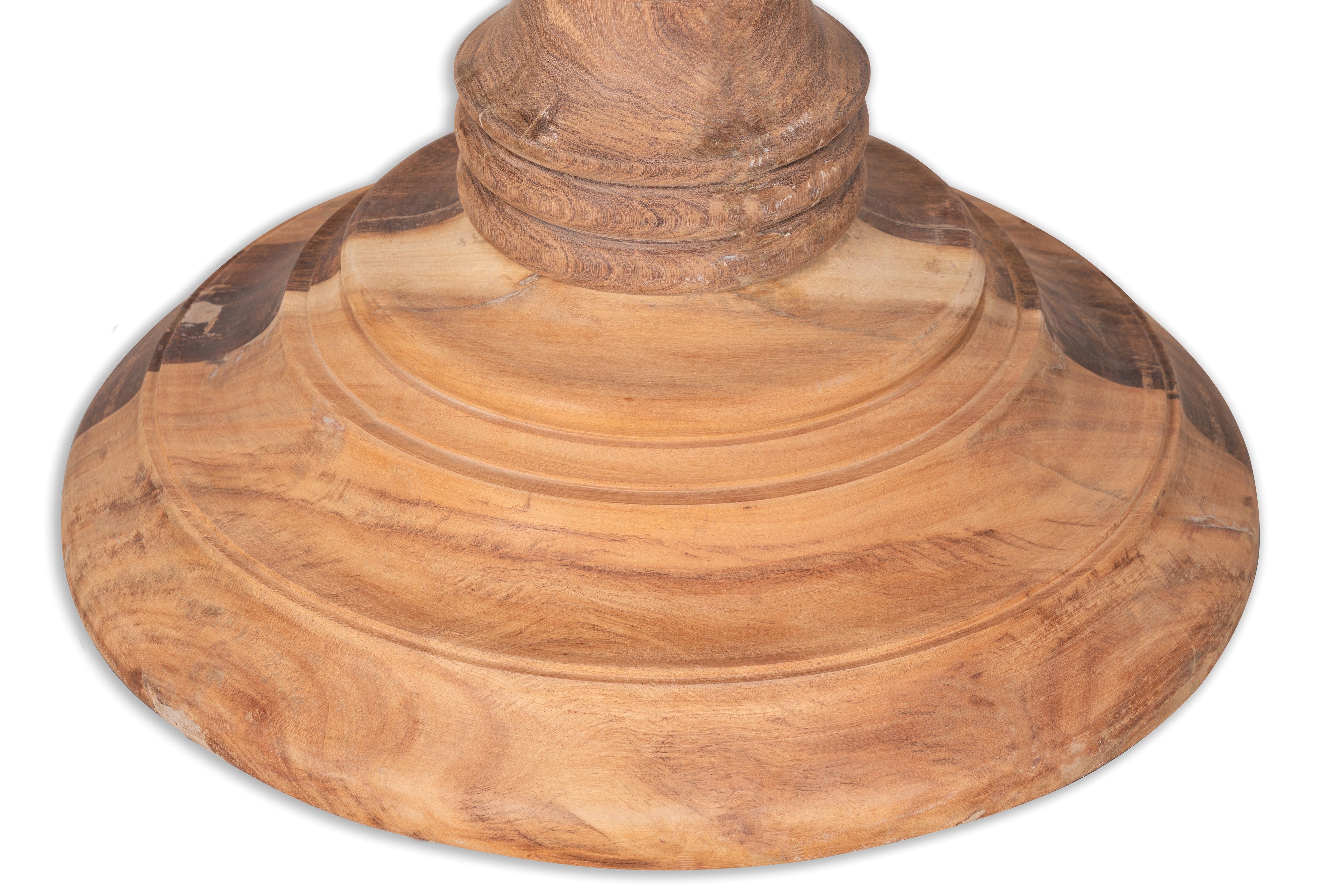 Close up image of the base of a round solid wood dining table made from reclaimed teak with carved pedestal base; rustic reclaimed teak wood dining table, 100 cm diameter × 78 cm height.