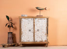 Carved wood furniture cupboard with white-washed engraved doors and mango wood body, 90 × 90 × 40 cm.