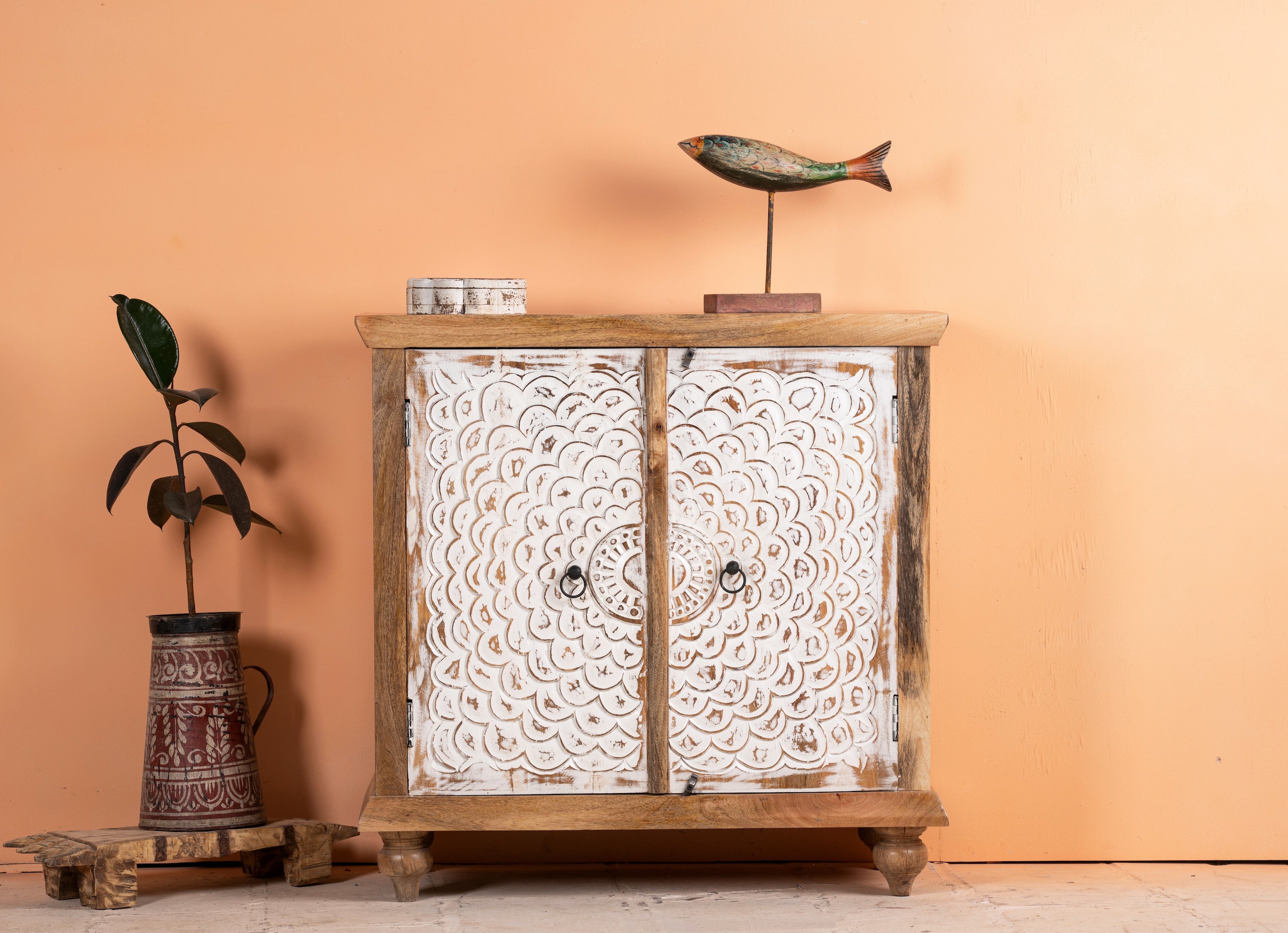 Carved wood furniture cupboard with white-washed engraved doors and mango wood body, 90 × 90 × 40 cm.