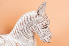 Close up image of a hand-carved whitewashed mango wood rocking horse – artistic Indian home accessory and mango wood décor, ideal for entryways or living rooms, 105x80x30cm.