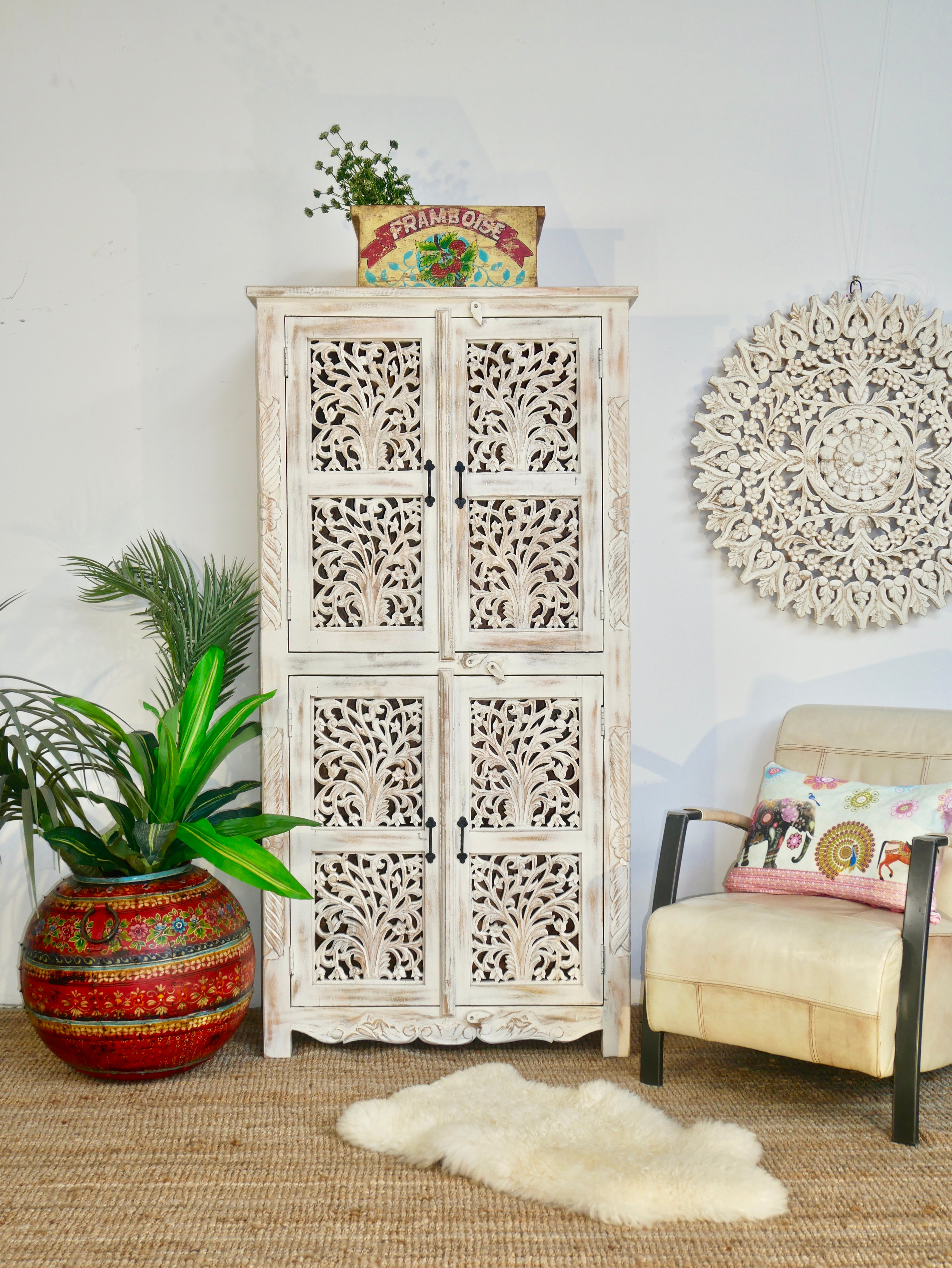 Hand-carved mango wood cabinet with white-washed finish – artisanal furniture combining Mediterranean design and functional elegance.