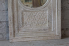 Close up image of a white washed tall vintage wall mirror with hand-carved mango wood frame; rustic hand carved mirror, 86 × 160 × 5 cm.