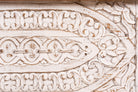 Close up image of a hand-carved mango wood vintage chest with whitewashed finish and iron fittings – elegant storage for bohemian or rustic interiors.