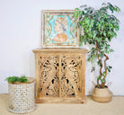 Wooden cabinet with hand-carved peacock doors, handcrafted mango wood furniture, Mediterranean-style storage unit, 90 × 90 × 40 cm.