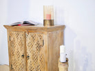 Side angle image of a hand-carved wood furniture made from solid mango wood, Mediterranean-style cabinet with Indian carvings, 90 × 90 × 40 cm.