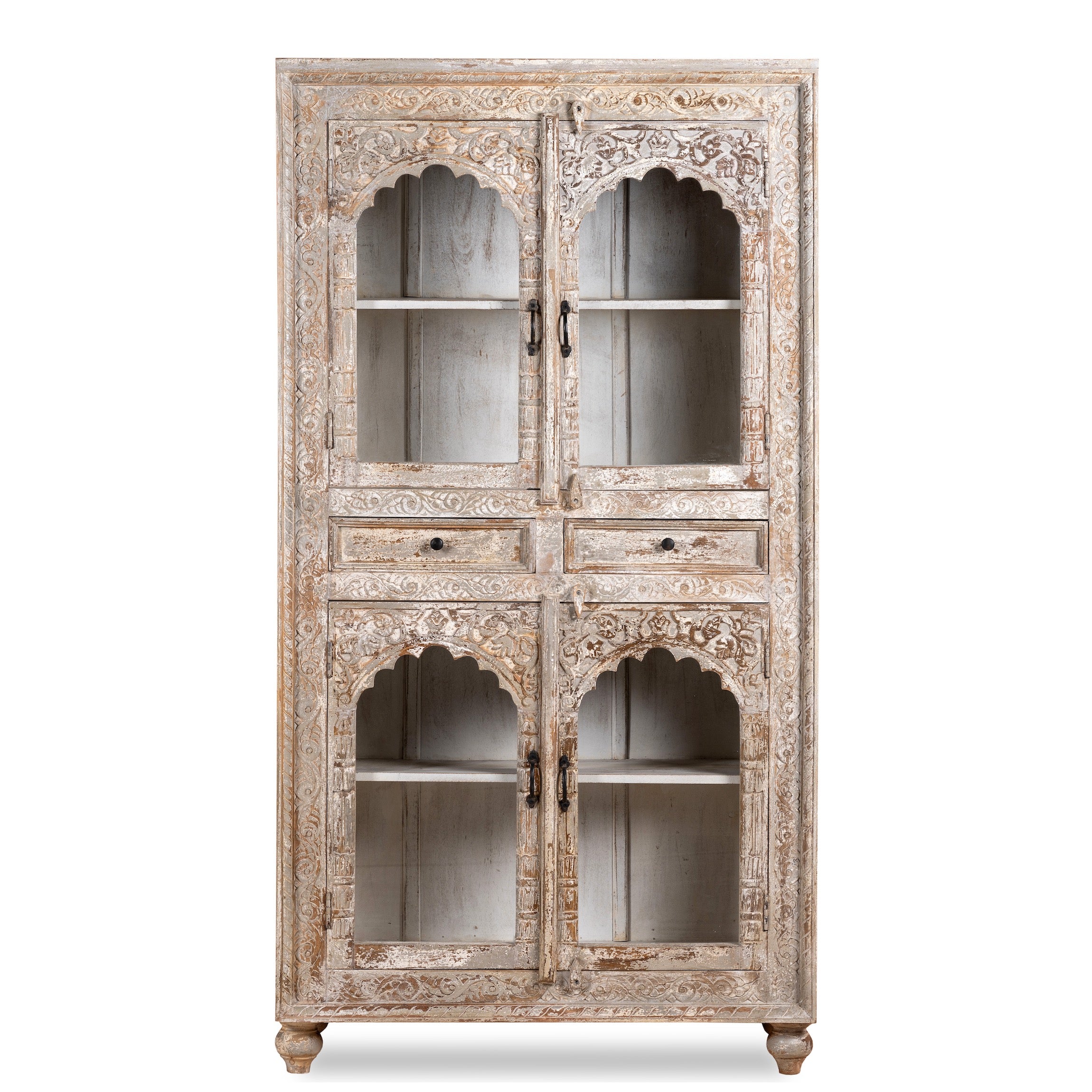 White background image of a hand-carved mango wood showcase with glass doors and drawers – carved wooden furniture in distressed turquoise and blue, combining artisan detail with vintage charm.
