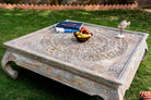 Square hand carved mango wood coffee table with floral top and vintage multi-layer finish; 120 × 120 × 45 cm.